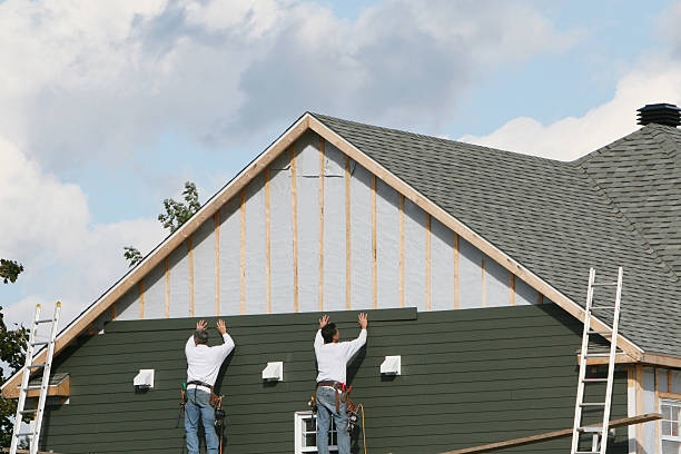 Professional Storm Damage Siding Repair technician working in Ashley, PA